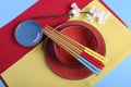 Modern Japanese oriental place setting in red, blue and yellow - aerial. Royalty Free Stock Photo