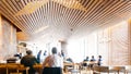 Modern Japanese restaurant decorated with wooden elements. Cozy Counter bar with customers