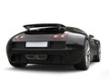 Modern jet black concept super car - back view Royalty Free Stock Photo
