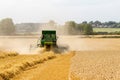 Modern John Deere combine harvester cutting crops Royalty Free Stock Photo