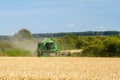 Modern John Deere combine harvester cutting crops Royalty Free Stock Photo