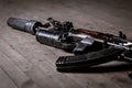 Modern kalashnikov assault rifle on wooden background. close up view of underbarrel grenade launcher Royalty Free Stock Photo