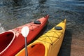 Modern kayaks with paddle on river, closeup. Summer camp activity Royalty Free Stock Photo