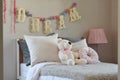 Modern kids room with doll and pillows