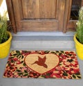 Modern Kingfisher bird printed zute doormat outside home with yellow flowers and leaves Royalty Free Stock Photo