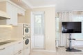 Modern kitchen area attached to the living room. Interior design with classic or vintage and modern elements. Royalty Free Stock Photo