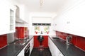 Modern kitchen with black, white and red panels