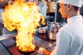 Modern kitchen. Cooks prepare meals on the stove in the kitchen of the restaurant or hotel. The fire in the kitchen.