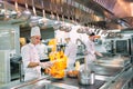 Modern kitchen. Cooks prepare meals on the stove in the kitchen of the restaurant or hotel. The fire in the kitchen. Royalty Free Stock Photo