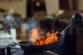 Modern kitchen. Cooks prepare meals on the stove in the kitchen of the restaurant or hotel. The fire in the kitchen. Royalty Free Stock Photo
