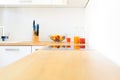 Modern kitchen counter with induction hob, fresh fruit and homemade lemonade