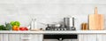 Modern kitchen countertop with domestic culinary utensils on it, home healthy cooking concept banner Royalty Free Stock Photo