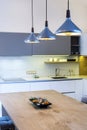 Modern kitchen design in light interior. Royalty Free Stock Photo