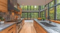 Modern kitchen with expansive forest views Royalty Free Stock Photo