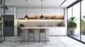 Modern kitchen featuring a white marble island, black pendant lights, and green plant accents. Royalty Free Stock Photo