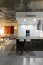 Modern kitchen with gray tile floor and white wall