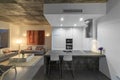 Modern kitchen with gray tile floor and white wall