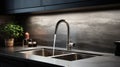 Modern kitchen interior in dark tones with sink and tap with running water Royalty Free Stock Photo