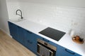 Modern kitchen interior design. Nordic style blue cabinets and white countertop top view Royalty Free Stock Photo