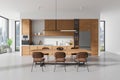 Modern kitchen interior with dining area, wooden finishes