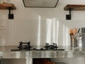 Modern kitchen interior with dining table with retro decor elements, vintage fixtures, stylish interior, concrete and