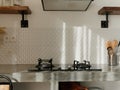 Modern kitchen interior with dining table with retro decor elements, vintage fixtures, stylish interior, concrete and