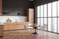 Modern kitchen interior with eating table and seats, panoramic window Royalty Free Stock Photo