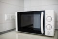 Modern kitchen interior with electric and microwave oven. Royalty Free Stock Photo