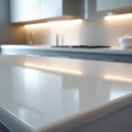 Modern kitchen interior featuring a sleek, glossy countertop reflecting soft lighting. Royalty Free Stock Photo