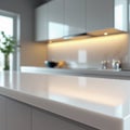 Modern kitchen interior featuring a sleek, glossy countertop reflecting soft lighting. Royalty Free Stock Photo