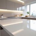 Modern kitchen interior featuring a sleek, glossy countertop reflecting soft lighting. Royalty Free Stock Photo