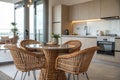 Interior of modern stylish kitchen with wicker chairs and table Royalty Free Stock Photo