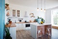 Modern Kitchen Interior with Island, Sink, Cabinets, and Big Window in New Luxury Home. Royalty Free Stock Photo