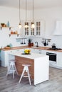 Modern Kitchen Interior with Island, Sink, Cabinets, and Big Window in New Luxury Home. Royalty Free Stock Photo