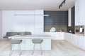 A modern kitchen interior with a large island, white and black elements, and wooden accents on an empty, clean background. 3D Royalty Free Stock Photo