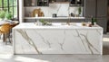 Modern Kitchen Interior with Large White Marble Island, Stylish Decor, and Ample Natural Light Royalty Free Stock Photo