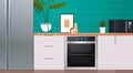 modern kitchen interior with new refrigerator oven and microvawe home appliances concept Royalty Free Stock Photo