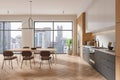 A modern kitchen interior with wooden elements and a dining area, set against a cityscape background, showcasing urban living. 3D Royalty Free Stock Photo