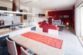 Modern kitchen with island, marble table and leather chairs