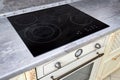 Modern kitchen luxurious interior with black induction or electric hob stove cooker with ceramic top surface with marble Royalty Free Stock Photo