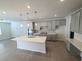 Modern kitchen in a luxury townhome with luxury vinyl plank flooring