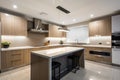 modern kitchen, with overhead lighting and under-cabinet lights creating a warm and welcoming atmosphere Royalty Free Stock Photo