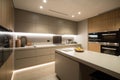 modern kitchen, with overhead lighting and under-cabinet lights creating a warm and welcoming atmosphere Royalty Free Stock Photo
