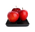 Modern kitchen scale with fresh red apples isolated on white Royalty Free Stock Photo
