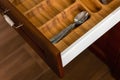 Set of cutlery trays in kitchen drawer