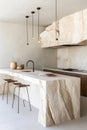 This modern kitchen showcases a unique blend of natural stone and minimalist style, creating an inviting and elegant Royalty Free Stock Photo