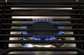 Modern Kitchen stove top cook. Gas flame close up on a natural gas stove range burner Royalty Free Stock Photo