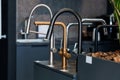 Modern Kitchen Taps Display in a Sleek Showroom Setting Royalty Free Stock Photo