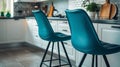 Modern kitchen with two blue barstools at the island. Royalty Free Stock Photo