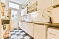 Kitchen with white black checkerboard floor